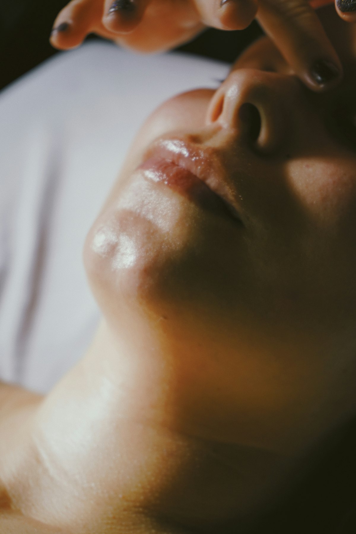Client receiving a facial treatment at VIBGYOR Skin Lab